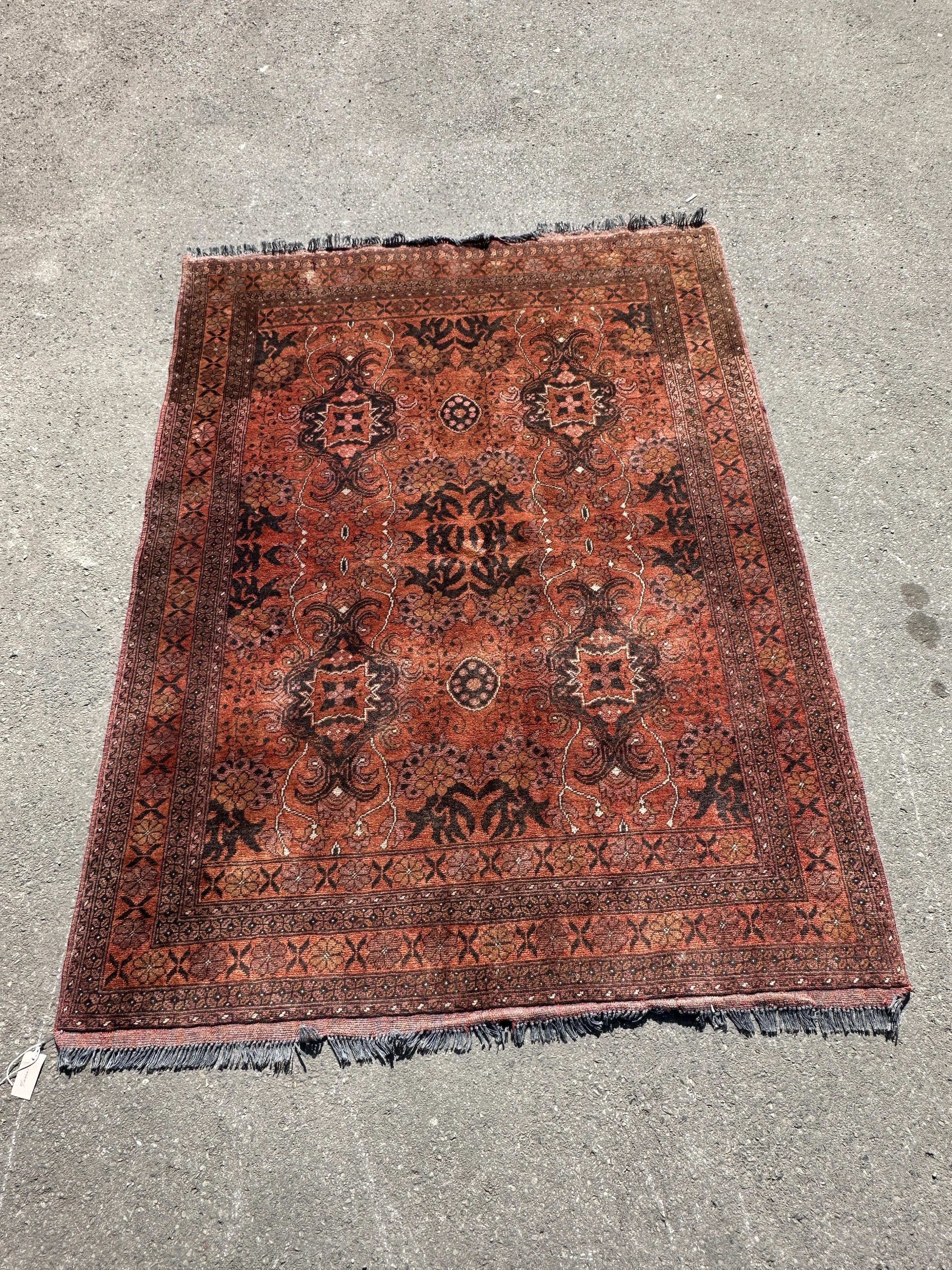 A Belouch red ground rug, 190 x 150cm.